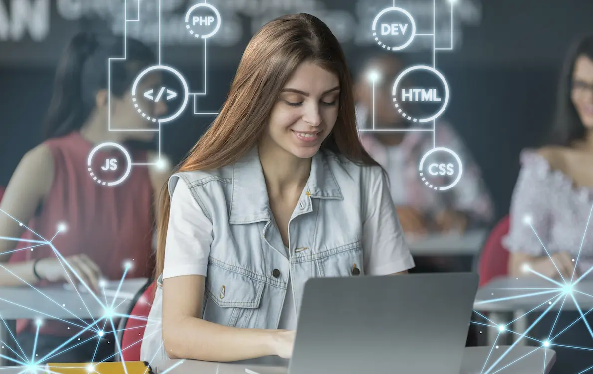 The girl is studying on a laptop.