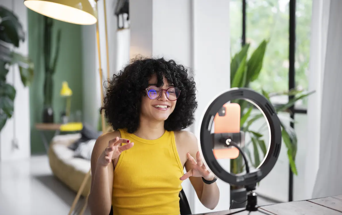 Yellow dressed girl is making short videos for social media